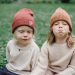 little kids in green yard in sunny day