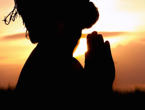 silhouette image of person praying